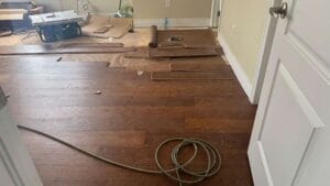 "Living room with wide-plank hardwood floors in a trendy Toronto apartment"